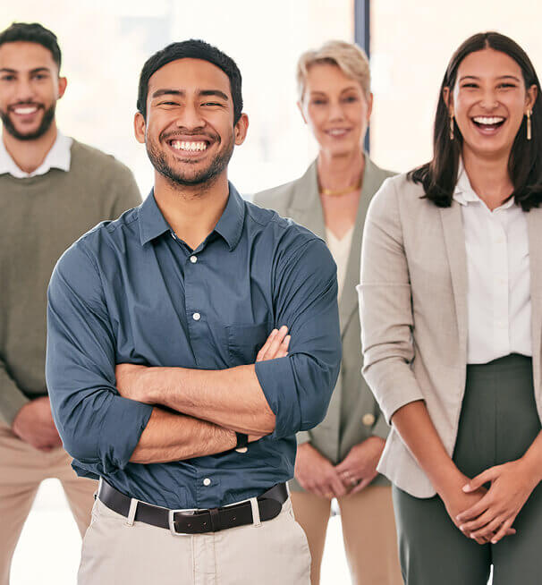 Business professionals smiling at the camera.