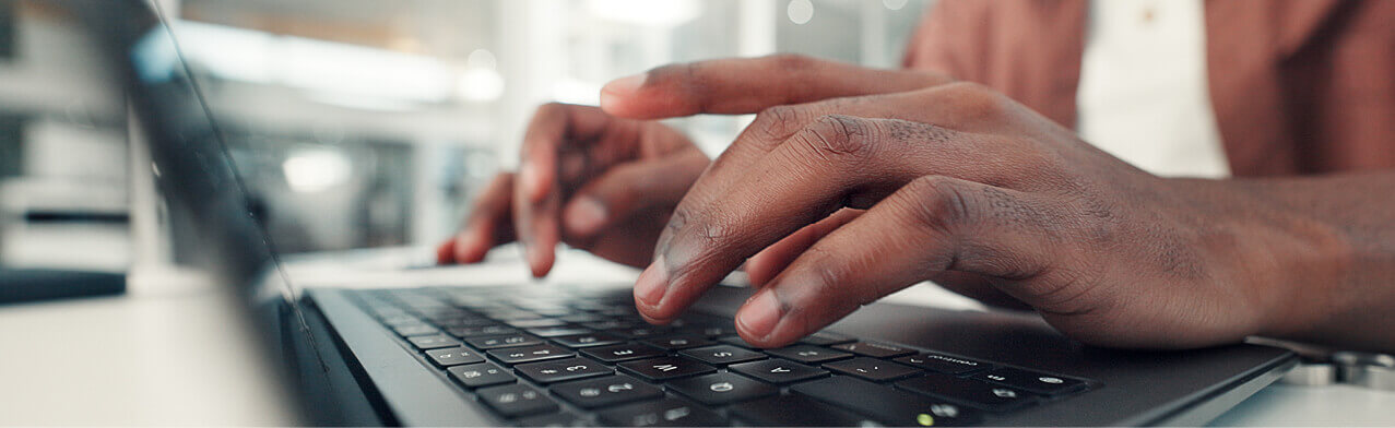 man typing on computer
